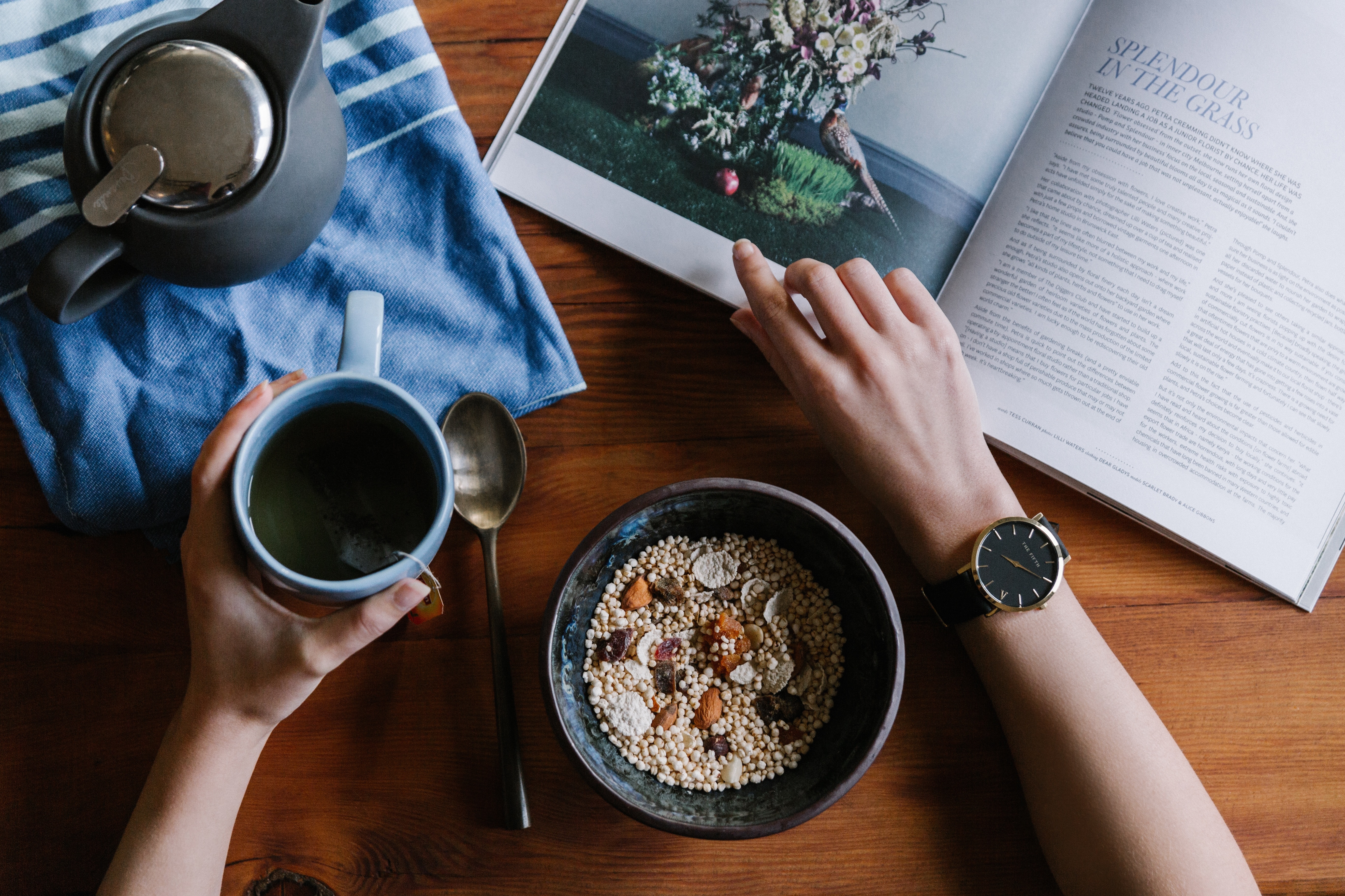 1st person perspective of someone studying at a table while eating cereal and drinking tea